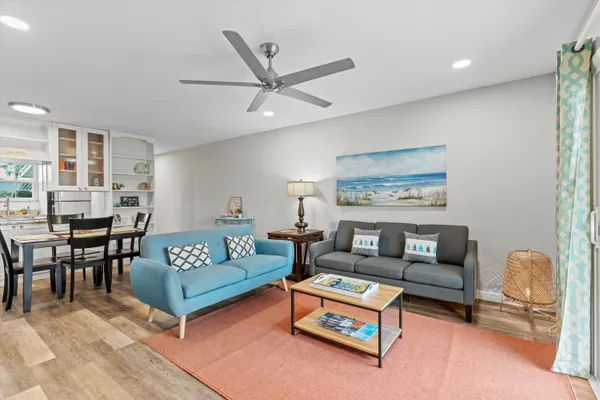 a living room with furniture and a rug