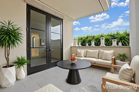 a outdoor living space with furniture and a potted plant