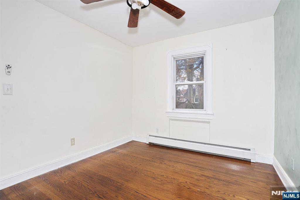 325 New Bridge Road Bergenfield, NJ 07621 - Photo 15 of 50 an empty room with a window