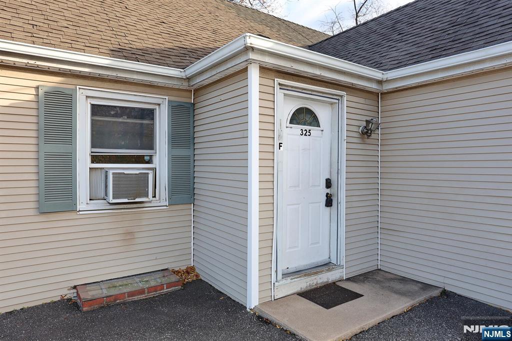 325 New Bridge Road Bergenfield, NJ 07621 - Photo 2 of 50 a view of front door and a yard