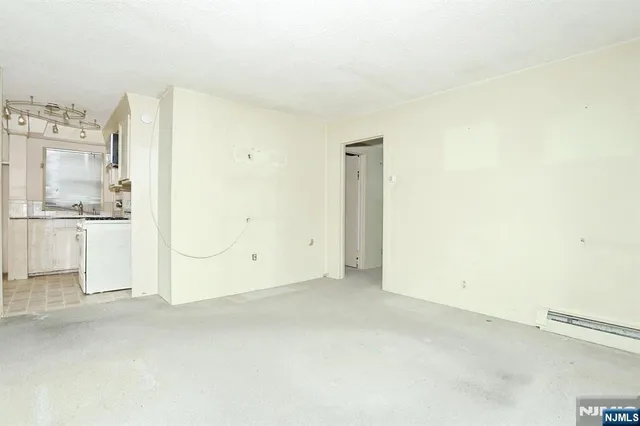 a view of a kitchen with a sink and cabinet area