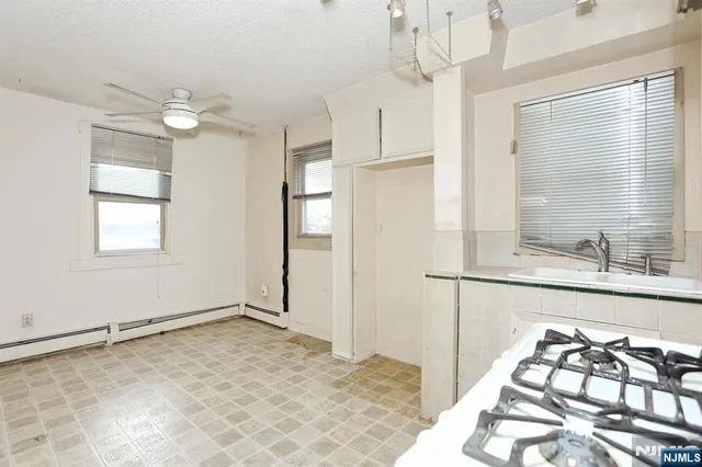 a kitchen with cabinets and appliances