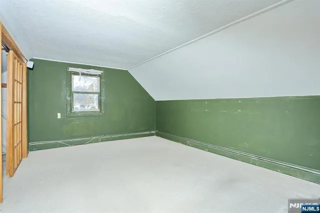 a view of a big room with closet and chandelier fan