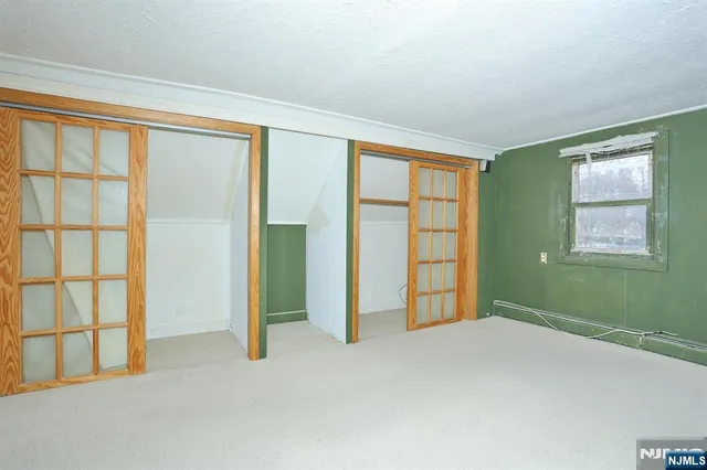 a view of storage and utility room with washer and dryer