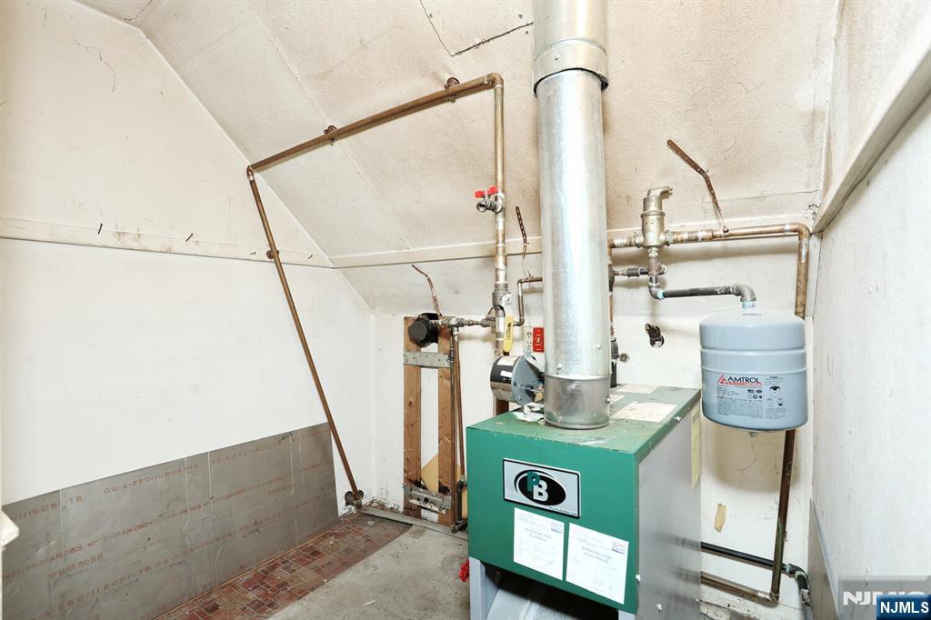 325 New Bridge Road Bergenfield, NJ 07621 - Photo 32 of 50 a view of storage and utility room with washer and dryer