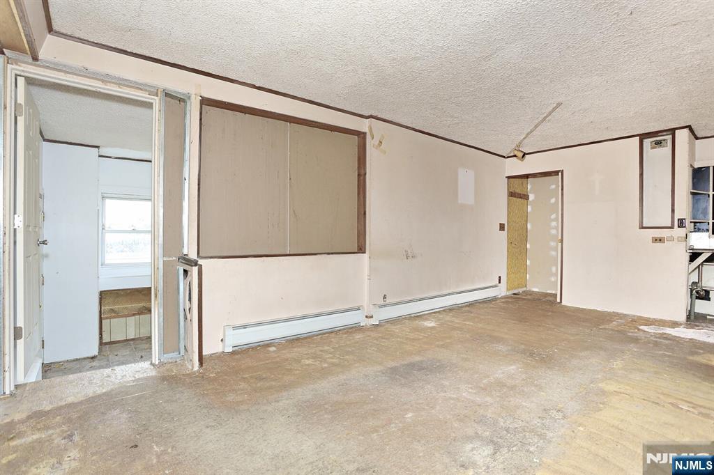 325 New Bridge Road Bergenfield, NJ 07621 - Photo 38 of 50 an empty room with closet