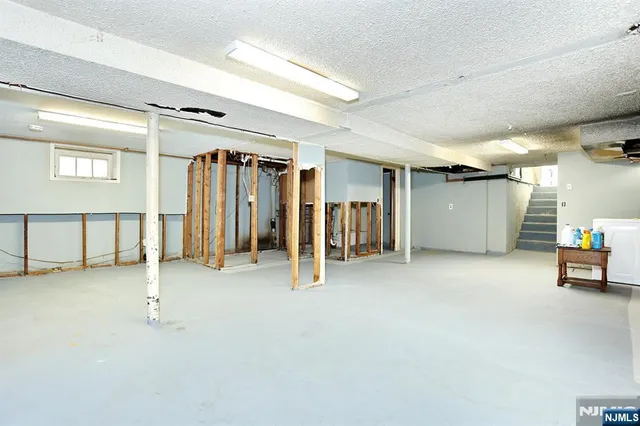 a view of a white house with a yard