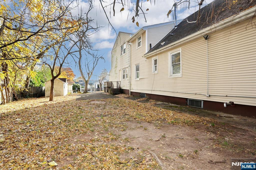 325 New Bridge Road Bergenfield, NJ 07621 - Photo 48 of 50 a house view with a backyard