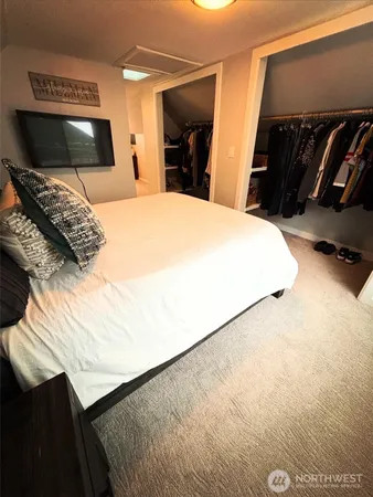 a bedroom with a bed and a view of bedroom