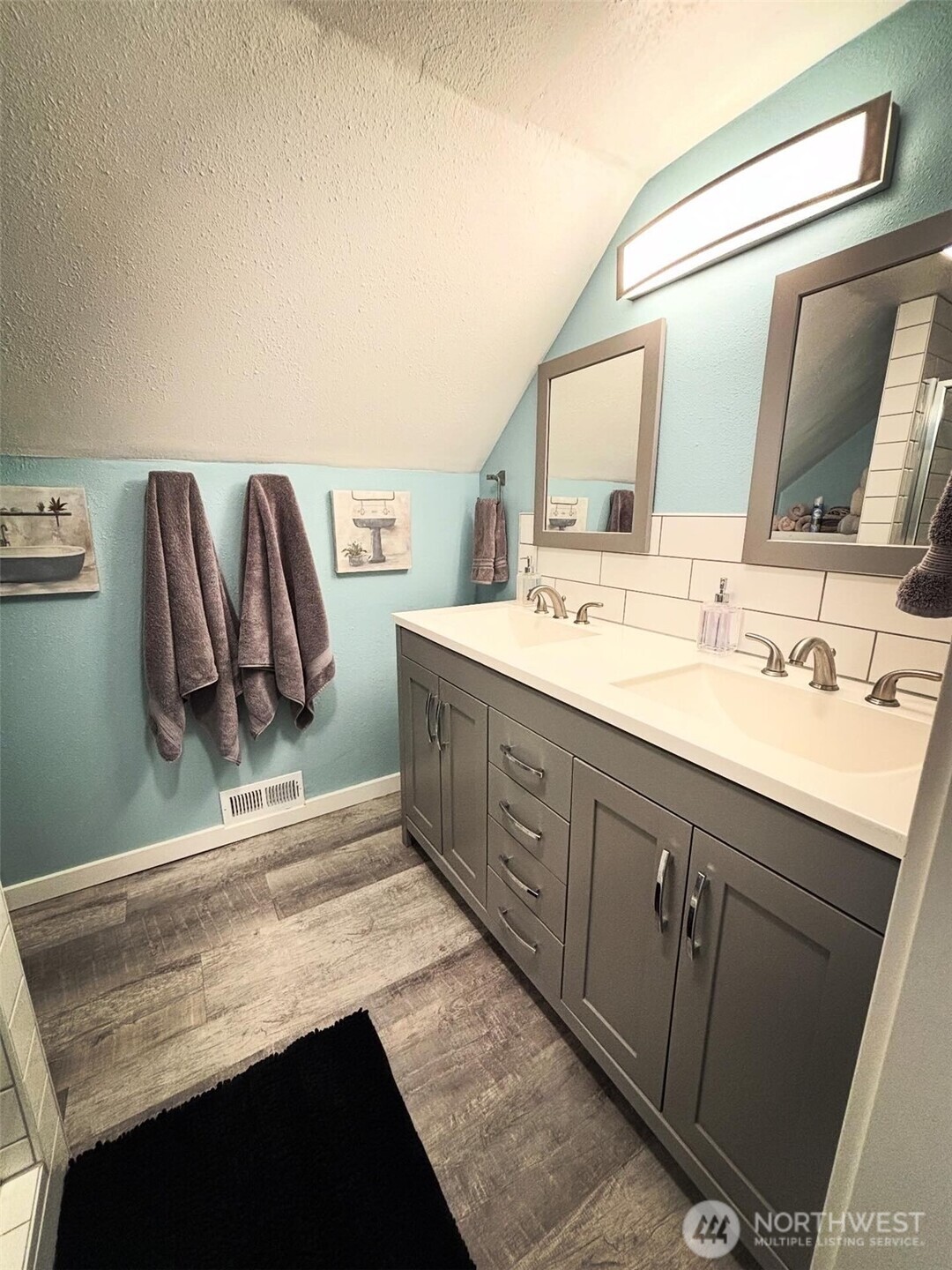 336 Harvard Avenue Fircrest, WA 98466 - Photo 14 of 17 a bathroom with a sink double vanity and a mirror
