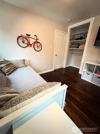a bedroom with a bed and a dresser