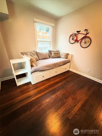 a bedroom with a bed and a table