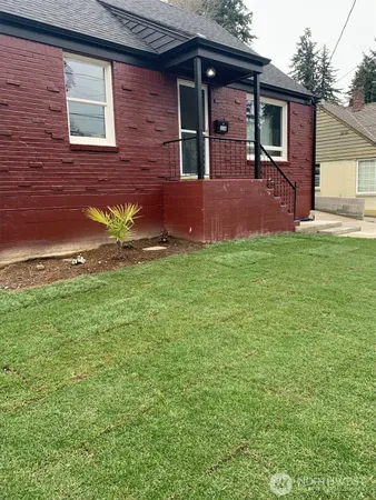 a front view of a house with garden