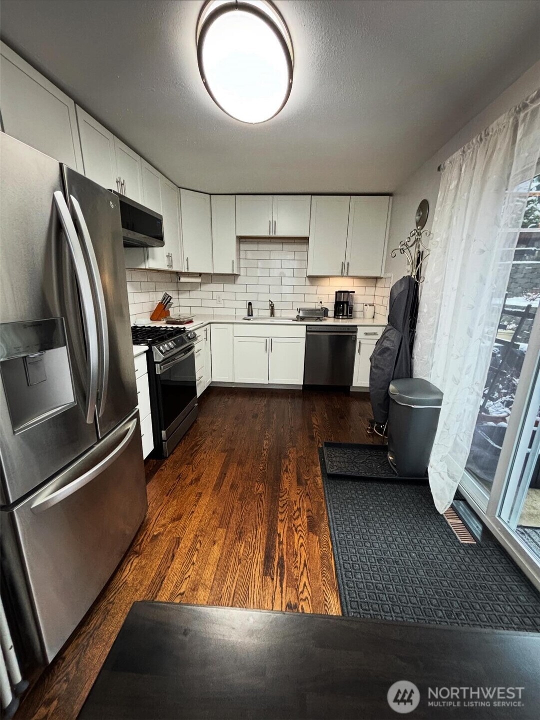 336 Harvard Avenue Fircrest, WA 98466 - Photo 6 of 17 a kitchen with stainless steel appliances a refrigerator a stove a sink and a refrigerator