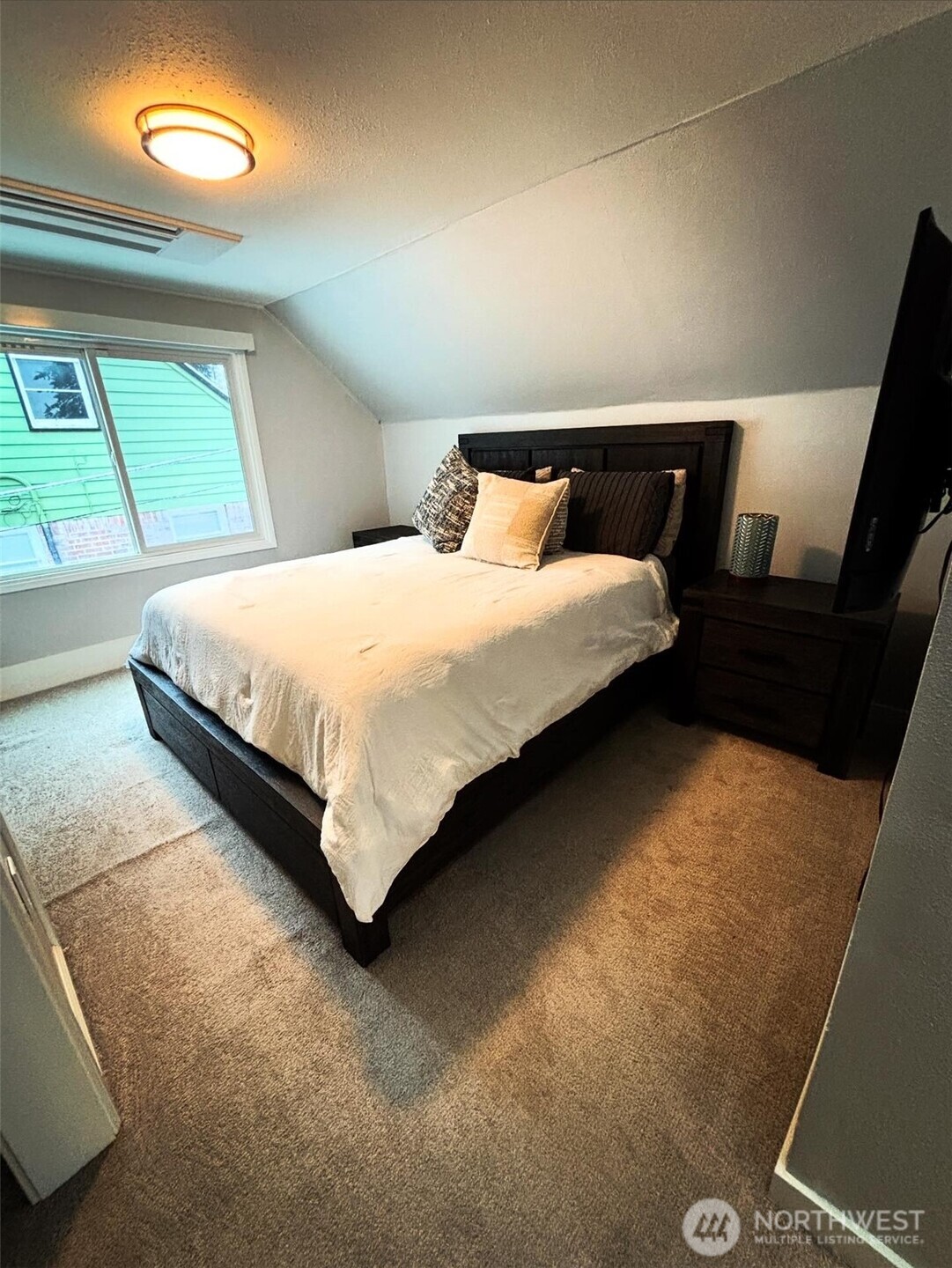 336 Harvard Avenue Fircrest, WA 98466 - Photo 10 of 17 a bedroom with a bed and a window