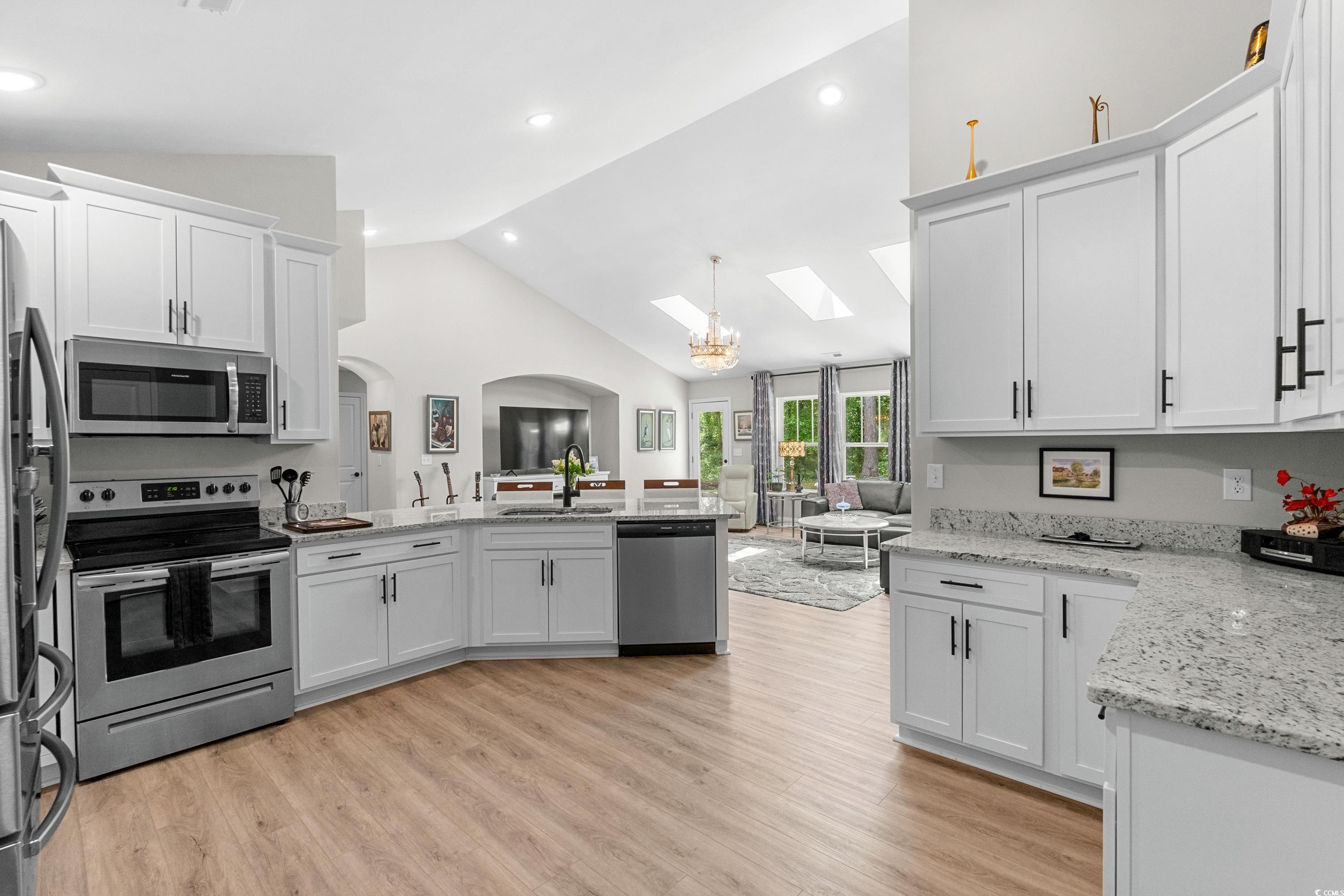 370 Foxtail Drive Longs, SC 29568 - Photo 13 of 40 Kitchen with white cabinets, vaulted ceiling with