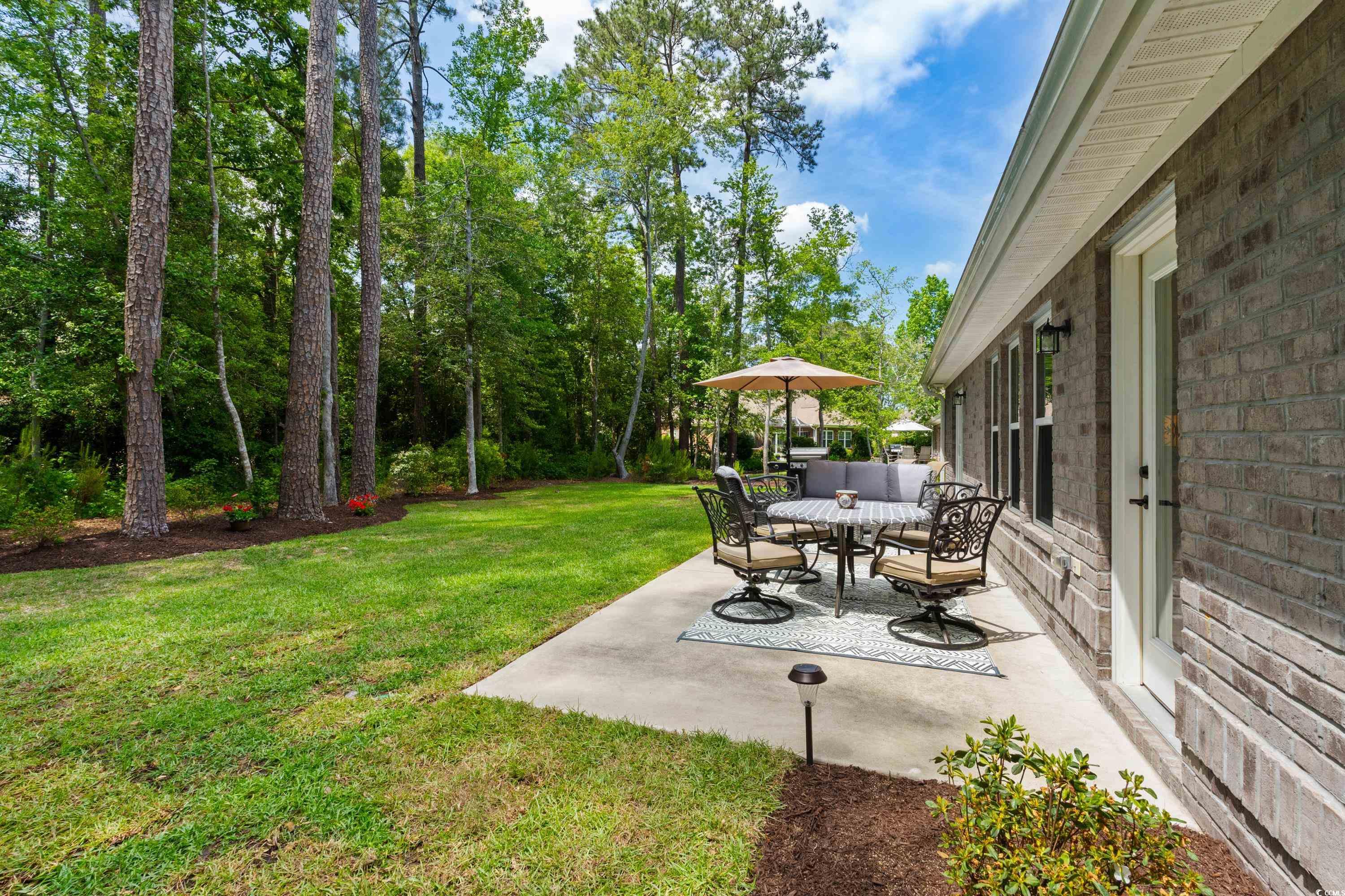 370 Foxtail Drive Longs, SC 29568 - Photo 18 of 40 View of yard with outdoor dining space and a patio