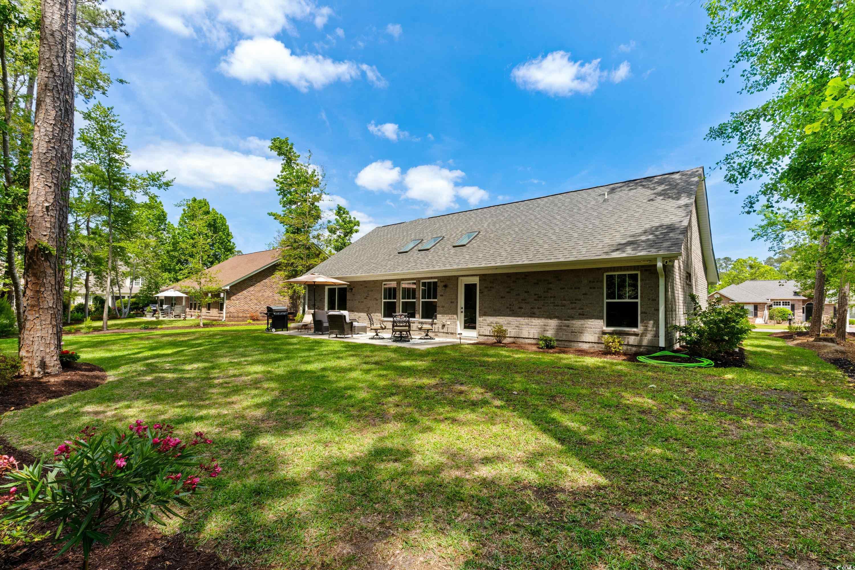 370 Foxtail Drive Longs, SC 29568 - Photo 21 of 40 Back of property featuring a shingled roof, a yard