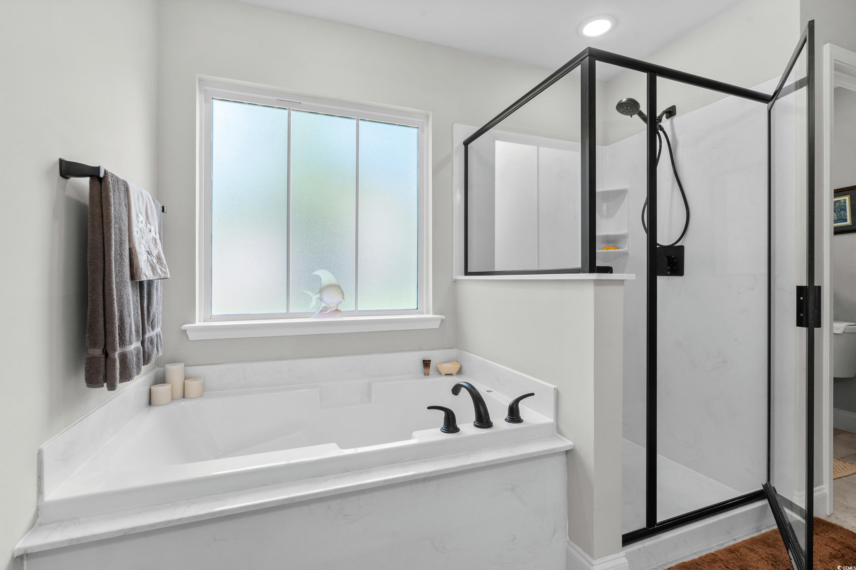 370 Foxtail Drive Longs, SC 29568 - Photo 26 of 40 Bathroom featuring a stall shower and a bath