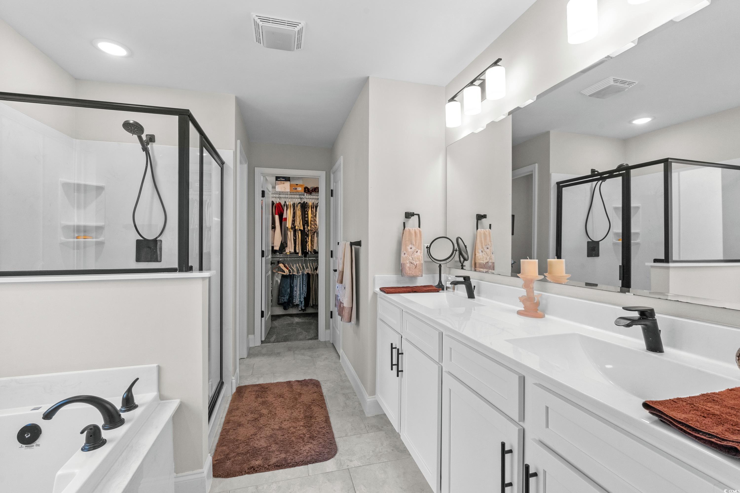 370 Foxtail Drive Longs, SC 29568 - Photo 27 of 40 Bathroom with visible vents, a sink, and a stall s