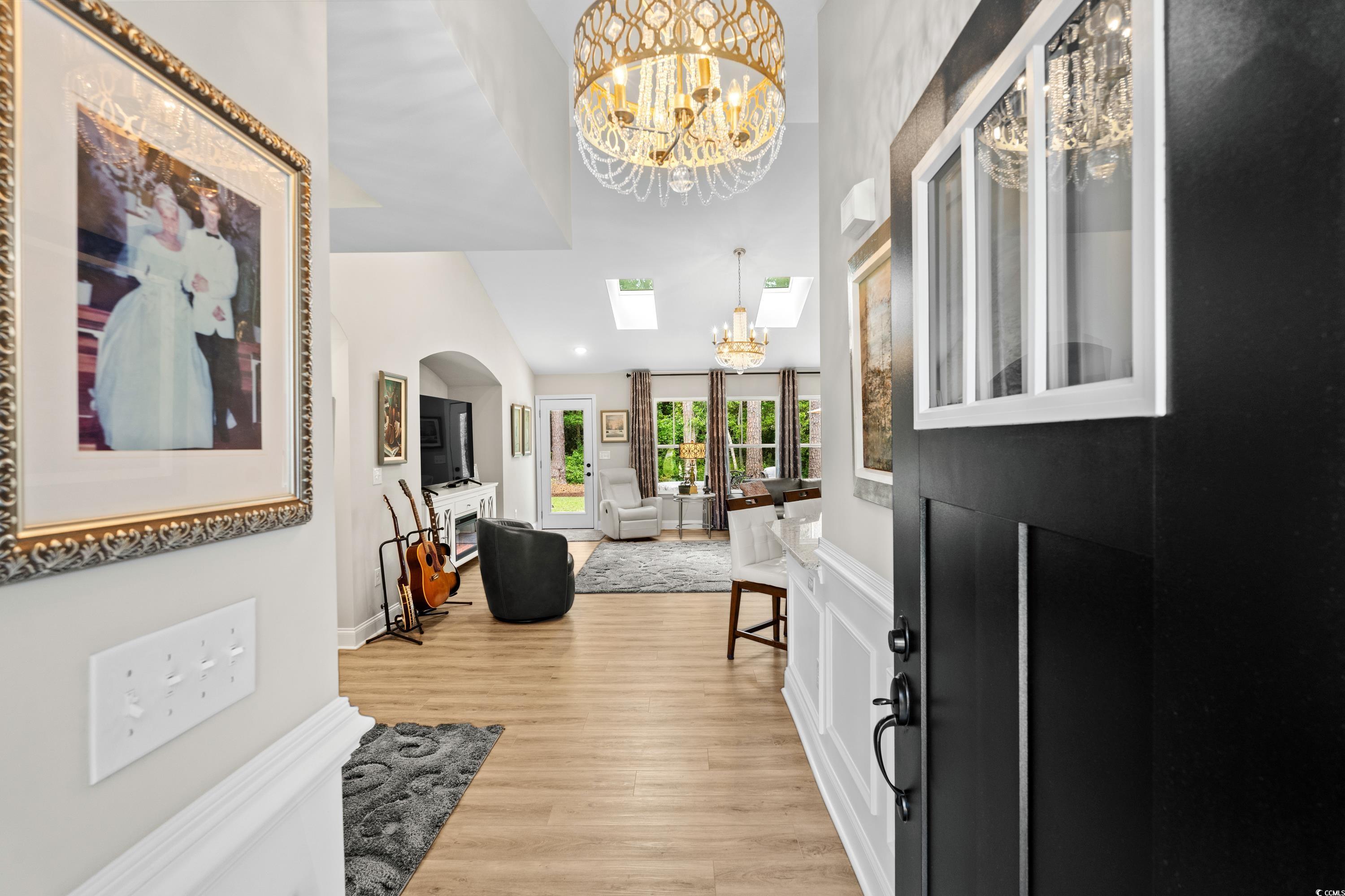 370 Foxtail Drive Longs, SC 29568 - Photo 4 of 40 Entrance foyer with an inviting chandelier, basebo