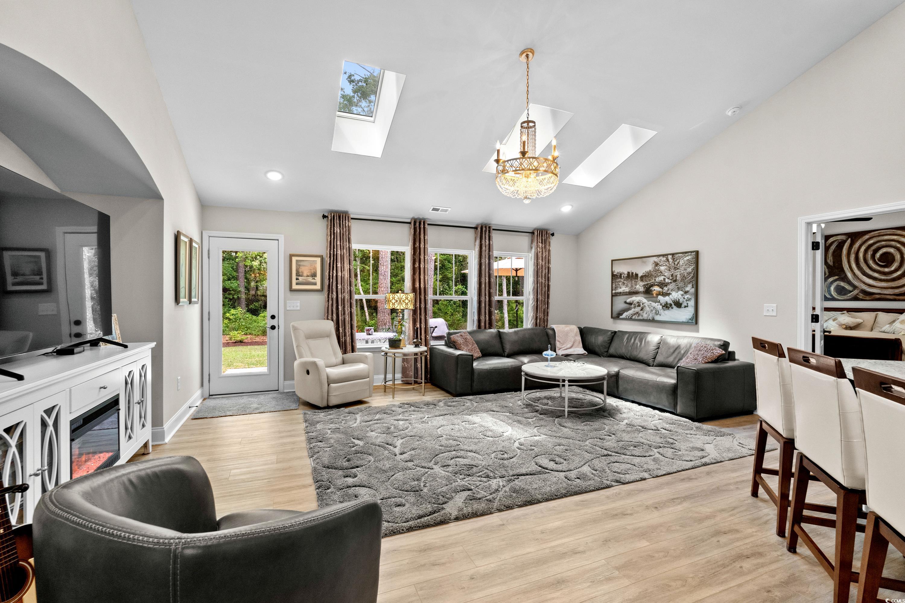 370 Foxtail Drive Longs, SC 29568 - Photo 6 of 40 Living area with a skylight, a notable chandelier,