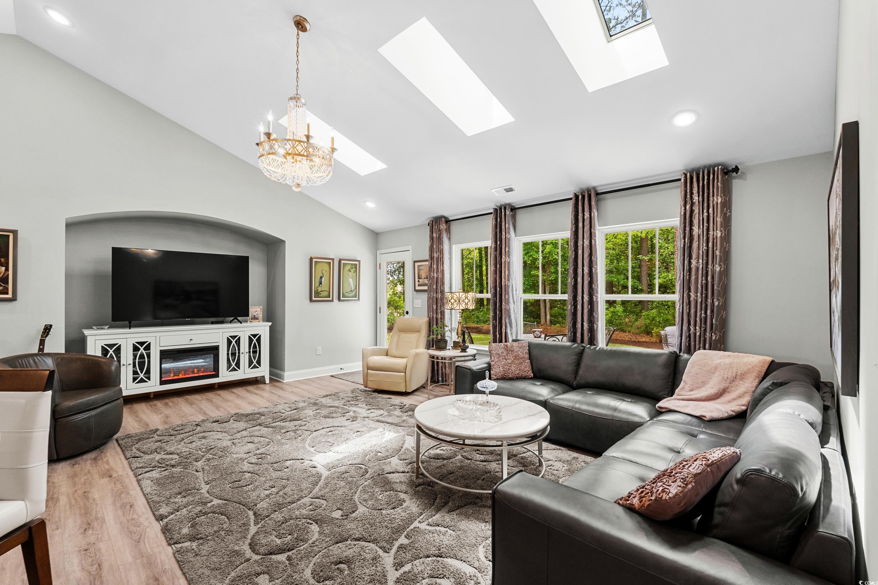 370 Foxtail Drive Longs, SC 29568 - Photo 8 of 40 Living room with an inviting chandelier, high vaul