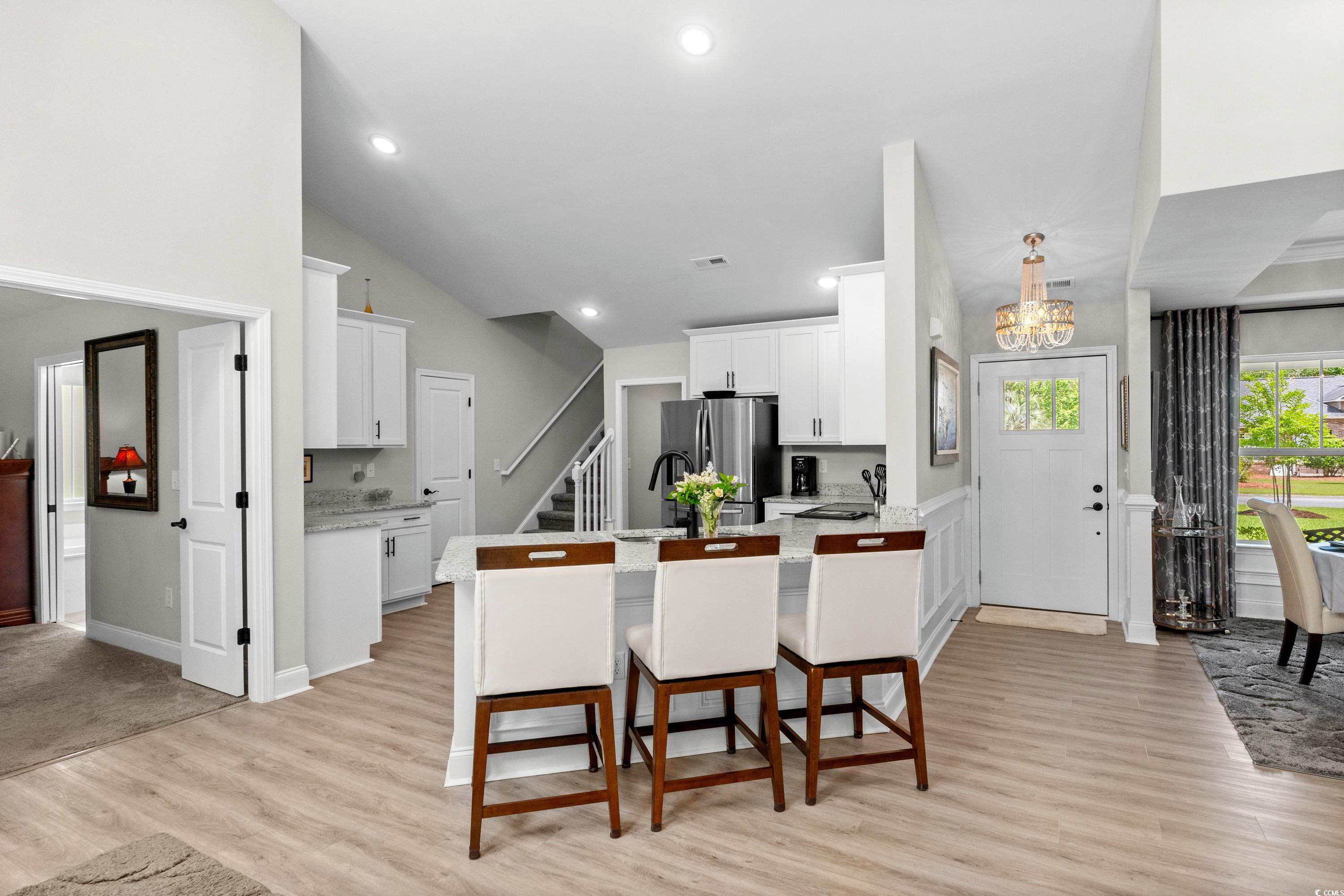 370 Foxtail Drive Longs, SC 29568 - Photo 10 of 40 Kitchen with white cabinets, a sink, a chandelier,