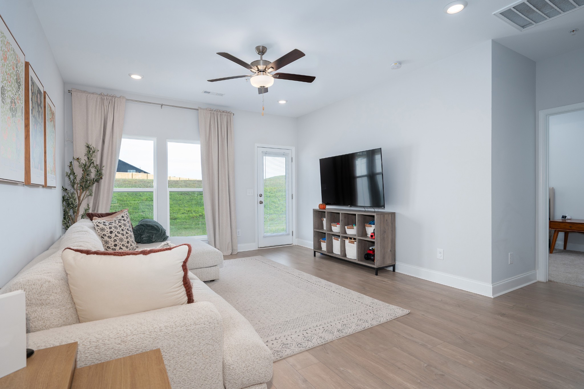 1060 June Wilde Ridge Spring Hill, TN 37174 - Photo 11 of 43 a living room with furniture and a flat screen tv