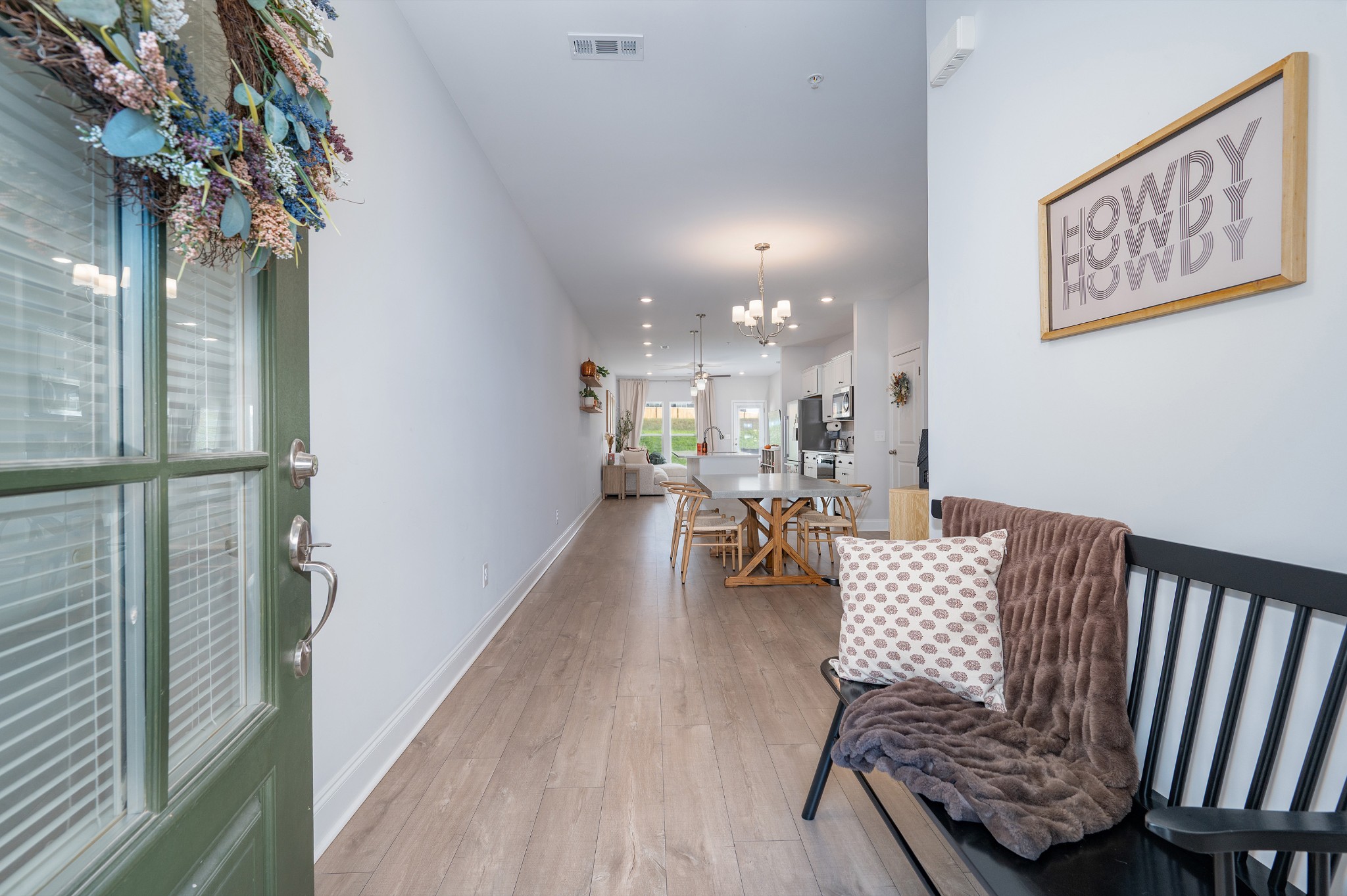 1060 June Wilde Ridge Spring Hill, TN 37174 - Photo 3 of 43 a living room with furniture and a chandelier