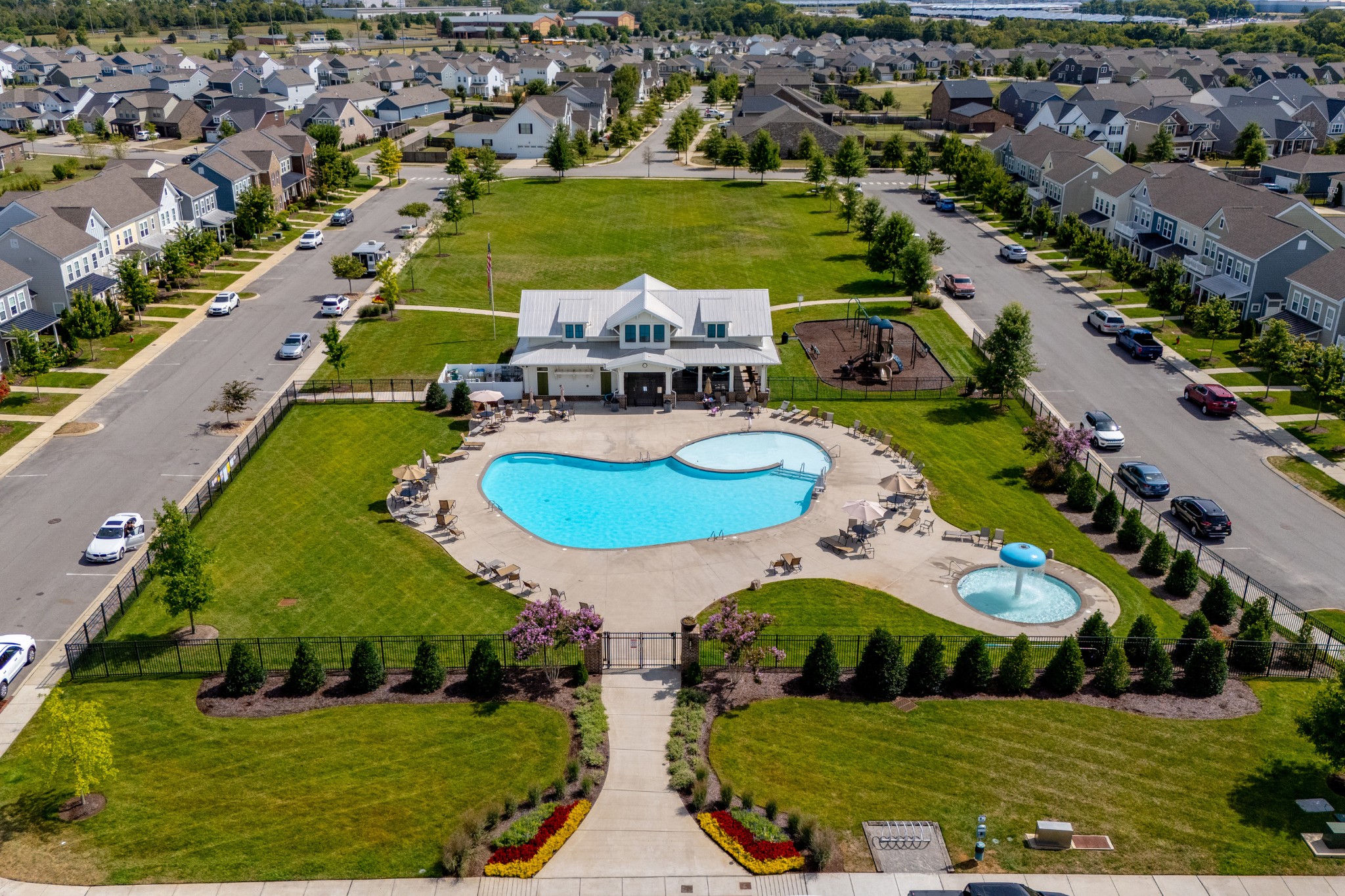 1060 June Wilde Ridge Spring Hill, TN 37174 - Photo 32 of 43 an aerial view of a pool playground patio swimming pool and outdoor seating