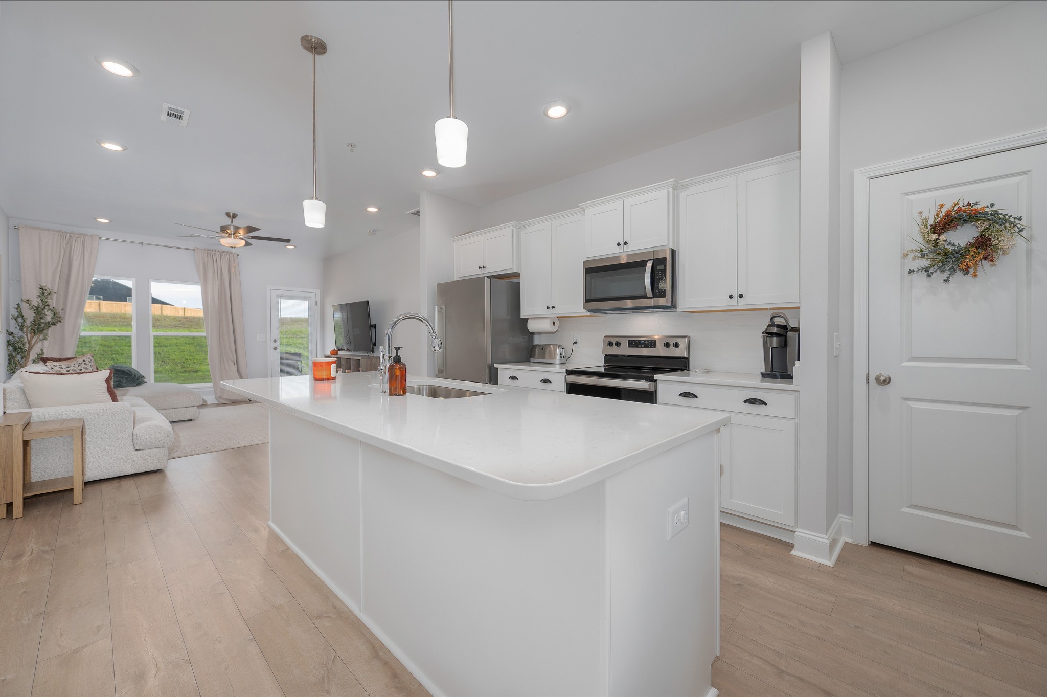1060 June Wilde Ridge Spring Hill, TN 37174 - Photo 6 of 43 a kitchen with stainless steel appliances a stove a sink a refrigerator and a refrigerator