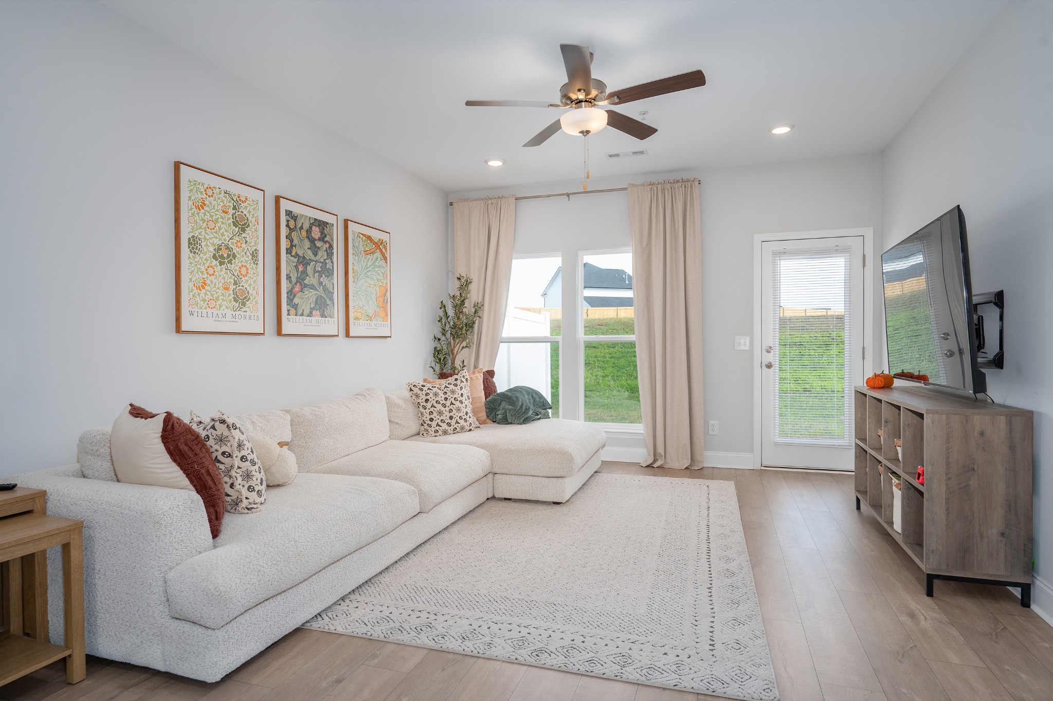 1060 June Wilde Ridge Spring Hill, TN 37174 - Photo 9 of 43 a living room with furniture and a flat screen tv