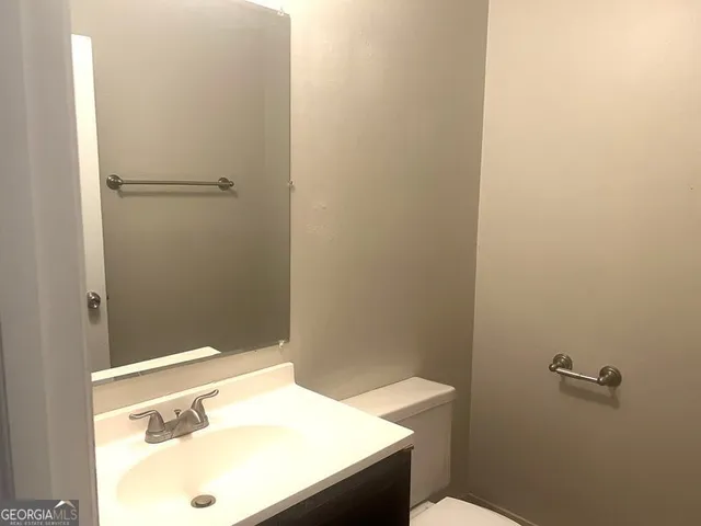 a bathroom with a sink and a vanity