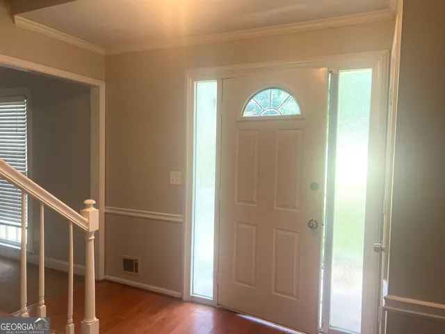a view of entryway with wooden floor