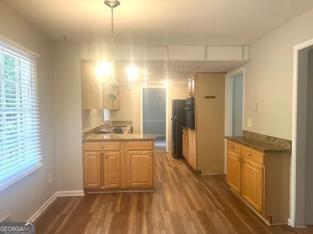 a bathroom with a sink a mirror and a shower