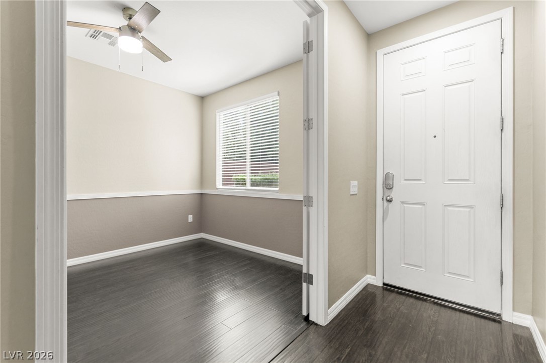 11048 Prairie Grove Road Las Vegas, NV 89179 - Photo 30 of 75 An inviting entrance with durable dark flooring leads to a flexible bonus room.