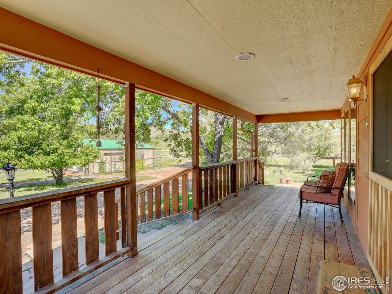 5196 Oxford Road Longmont, CO 80503 - Photo 19 of 38 a view of a two room with wooden floor and furniture