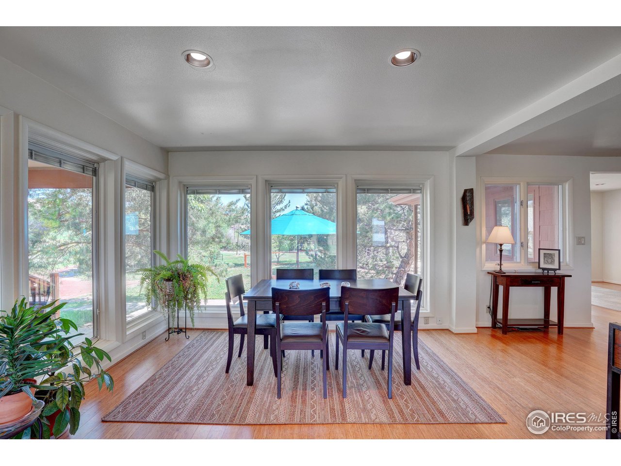 5196 Oxford Road Longmont, CO 80503 - Photo 21 of 38 a view of a dining room with furniture and wooden floor