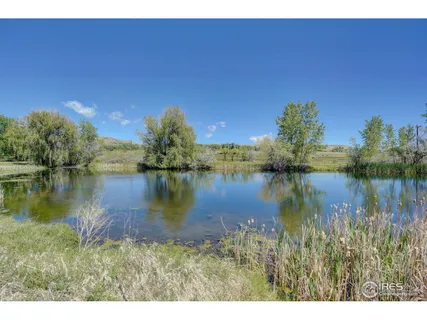 a view of a lake with a yard
