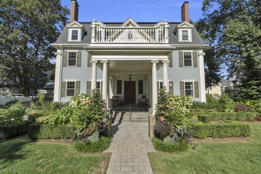 front view of a house with a yard