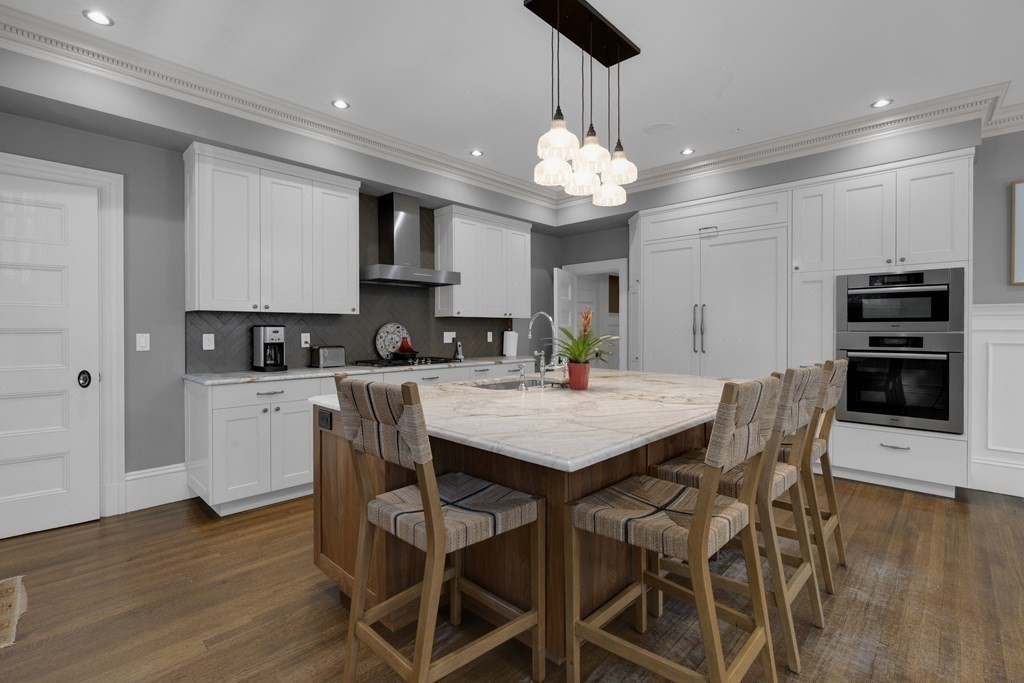 23 Eliot Street, Unit 1 Boston, MA 02130 - Photo 14 of 39 a view of a dining room with furniture wooden floor and chandelier