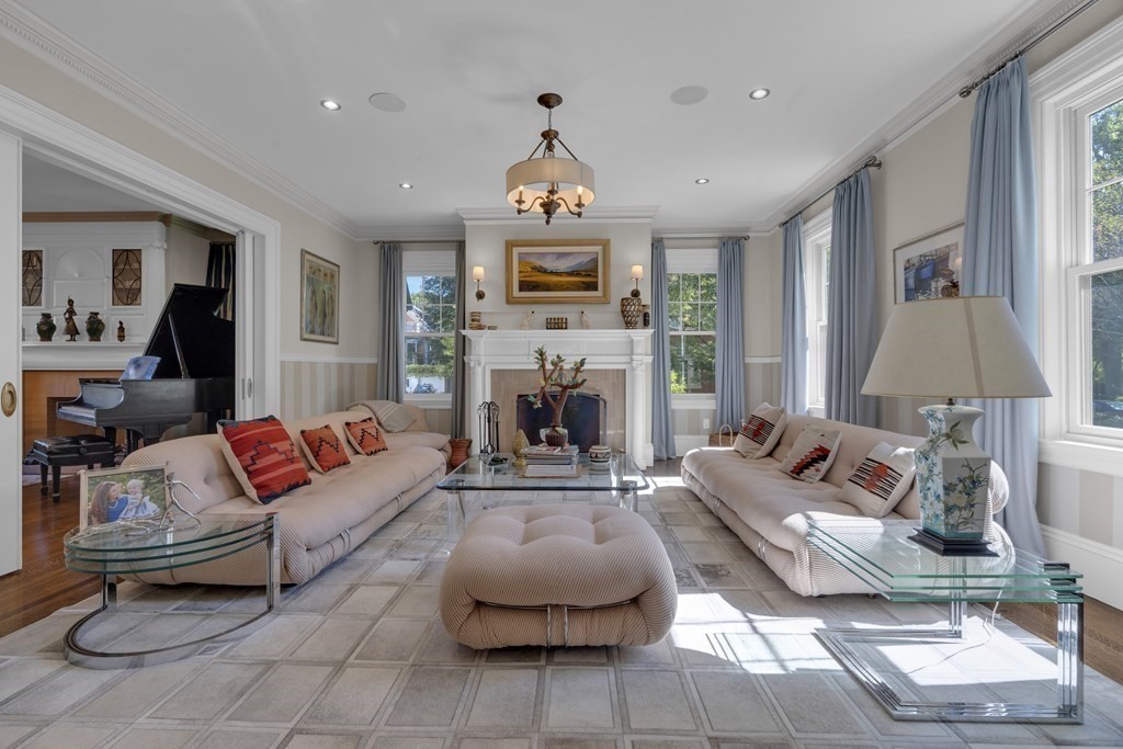 23 Eliot Street, Unit 1 Boston, MA 02130 - Photo 2 of 39 a living room with furniture a fireplace and a flat screen tv