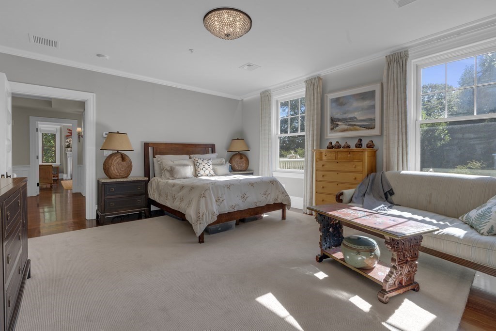 23 Eliot Street, Unit 1 Boston, MA 02130 - Photo 21 of 39 a bedroom with furniture and a window