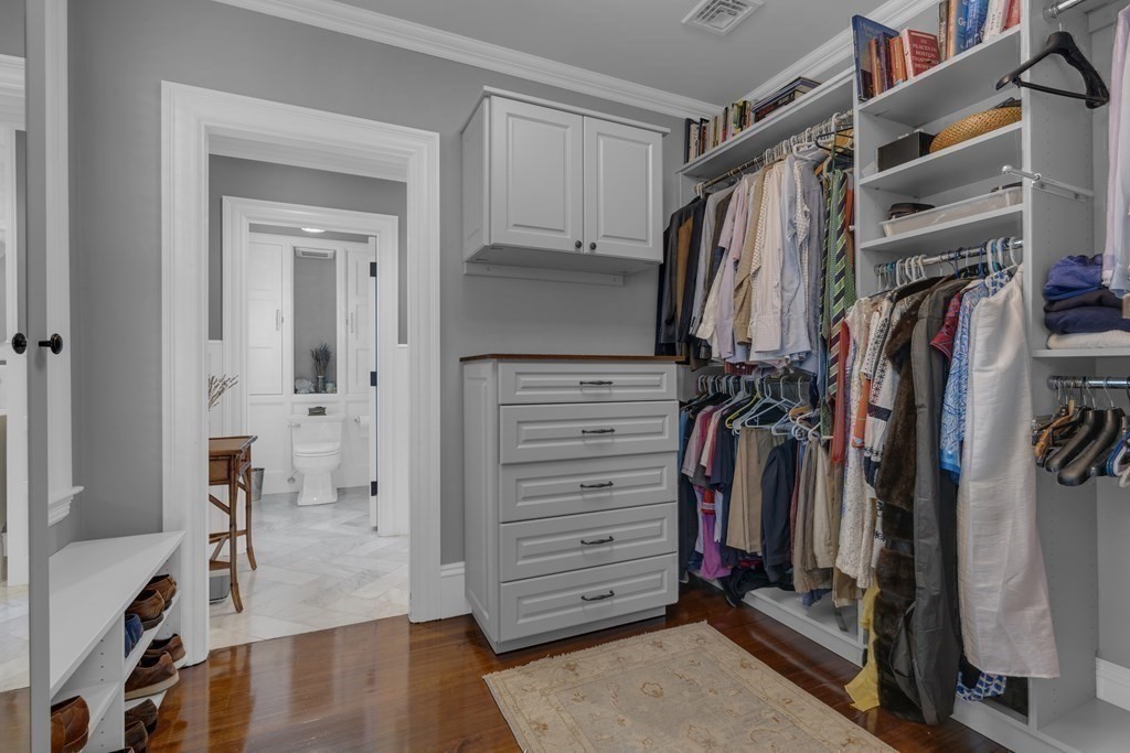 23 Eliot Street, Unit 1 Boston, MA 02130 - Photo 23 of 39 a view of walk in closet with clothes and shoes
