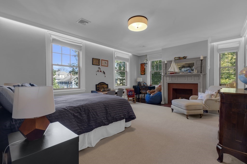 23 Eliot Street, Unit 1 Boston, MA 02130 - Photo 31 of 39 a spacious bedroom with a bed and a couch