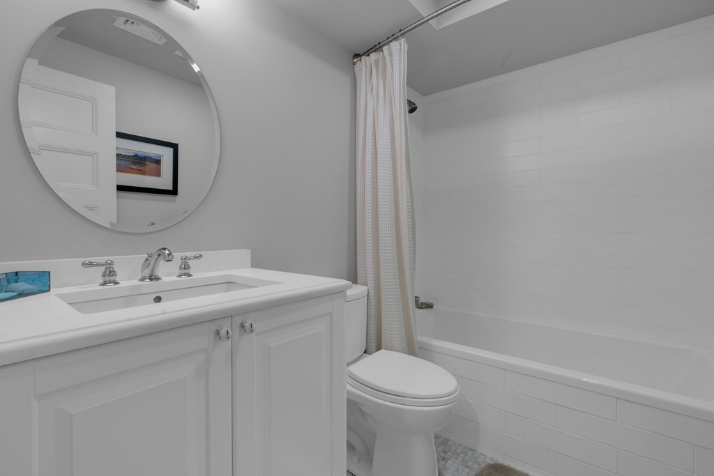 23 Eliot Street, Unit 1 Boston, MA 02130 - Photo 36 of 39 a bathroom with a sink a toilet and shower