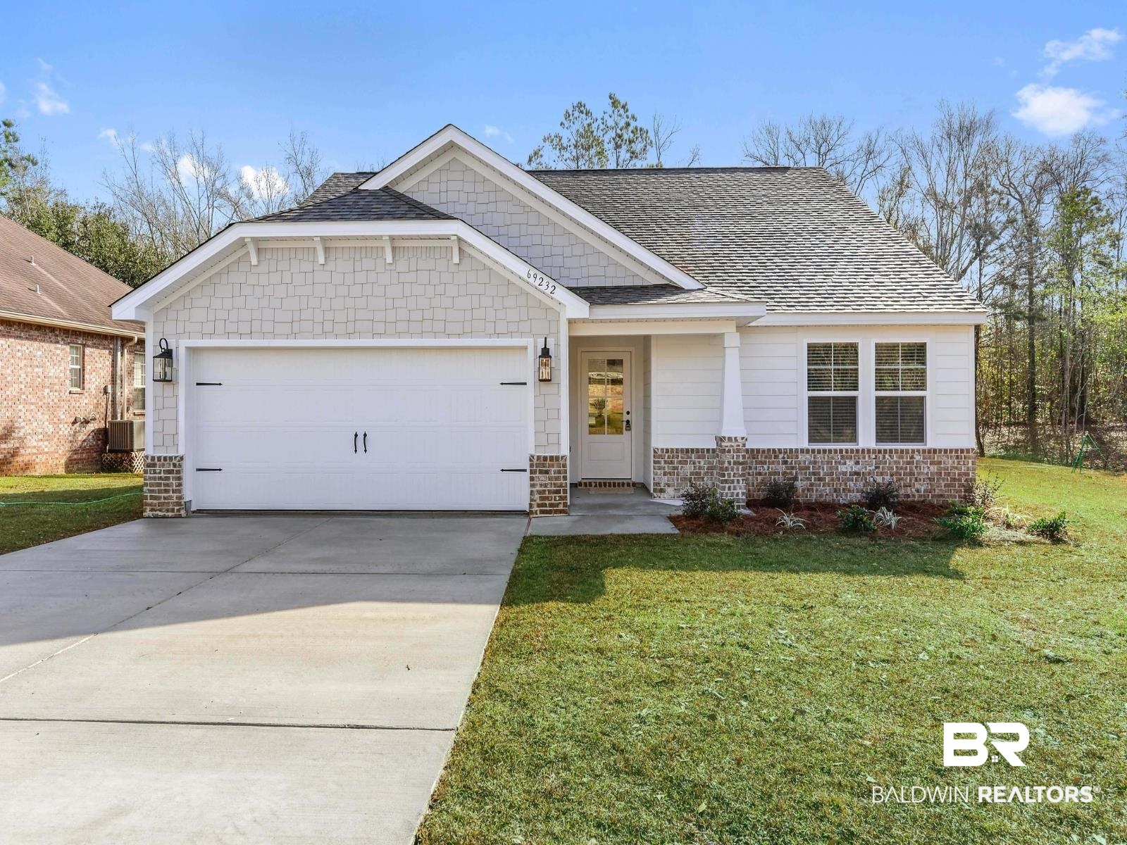 23911 Peppermint Street Elberta, AL 36530 - Photo 1 of 18 Craftsman inspired home featuring an attached garage, a front yard, concrete driveway, and a shingled roof