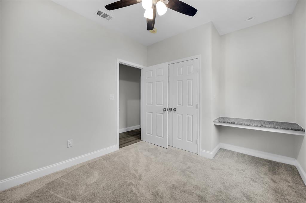 407 Dallas Street Rice, TX 75155 - Photo 18 of 25 an empty room with a ceiling fan