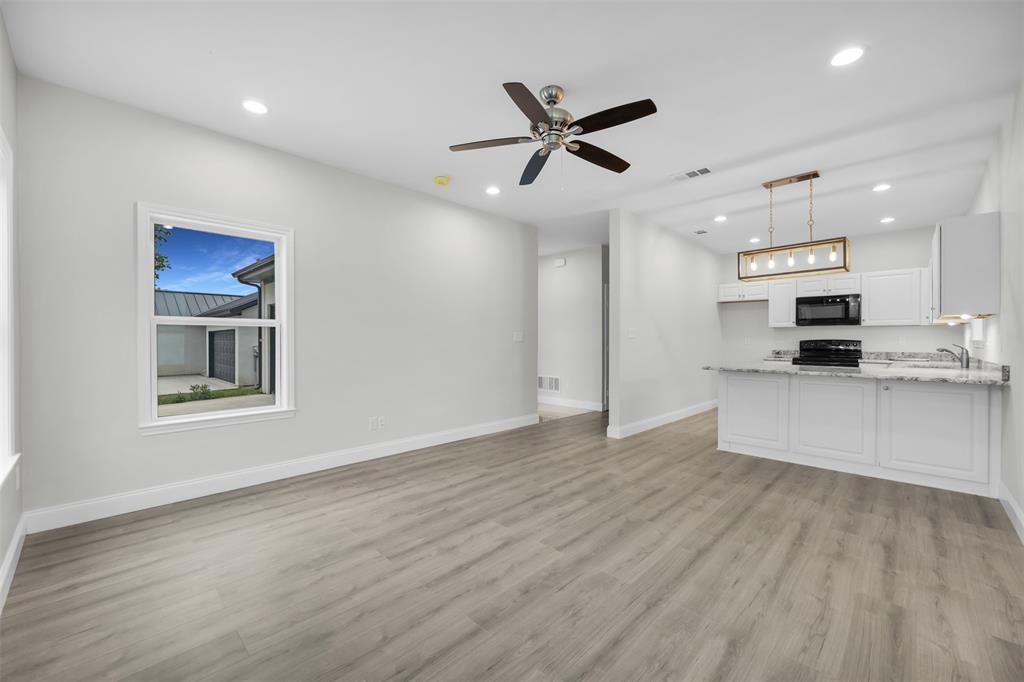 407 Dallas Street Rice, TX 75155 - Photo 7 of 25 a view of kitchen with sink microwave and stove